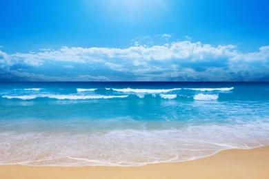 Summer time small waves on the beach 1366x768.jpg