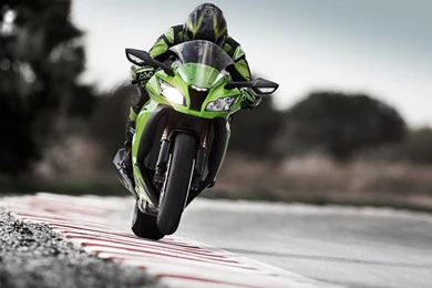 Bokeh man green motorcycle kawasaki ninja zx 10r raicing track trees 1920x1200.jpg