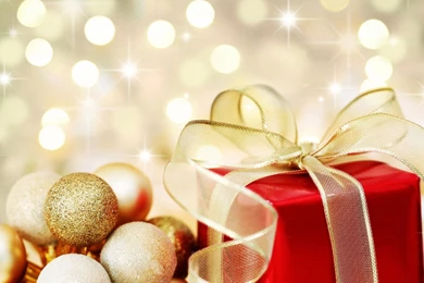 Christmas Gift On Defocused Lights Backgrounds